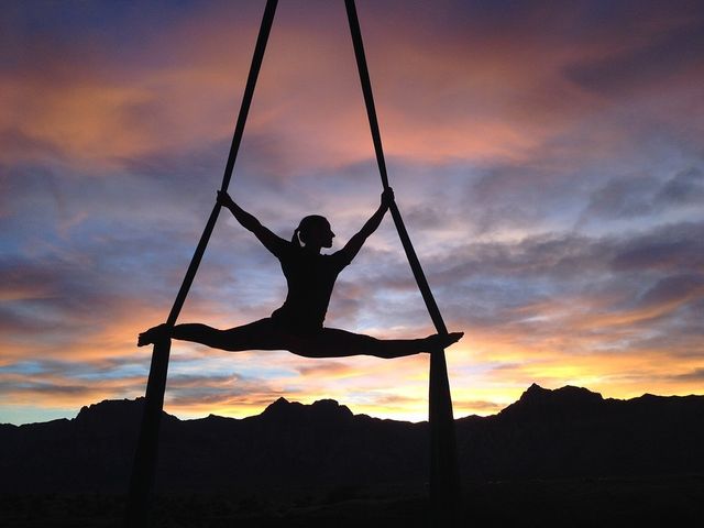 An acrobat against a sunset.