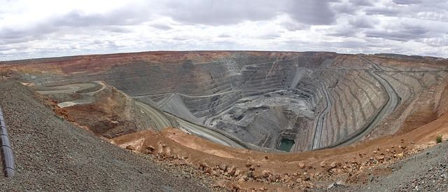 Gold mine in land. Cloudy sky, many layers