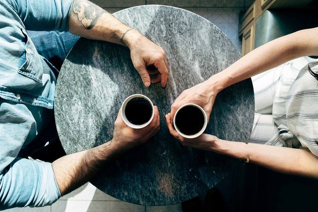 A mentoring session over coffee, between two people in mining in Australia.