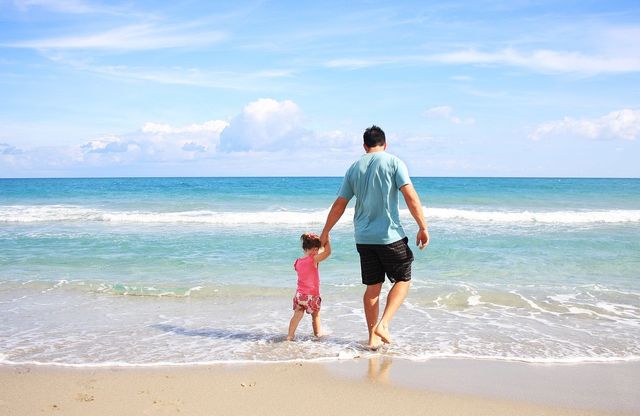 Father and daughter on the bech