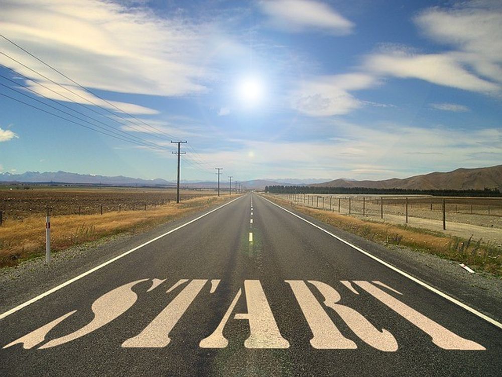 An outback road with ‘start’ written on the ground.