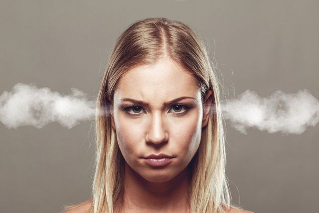 Woman with steam coming out her ears