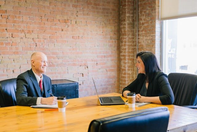 Two mining industry board members meeting in a boardroom.