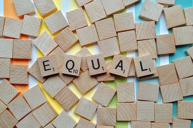 'EQUAL' spelled out in Scrabble tiles