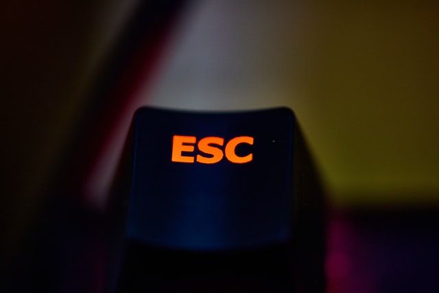 Escape key on a keyboard, lit red, symbolising mining industry employee retention strategies.