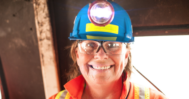 Female mine worker smiling