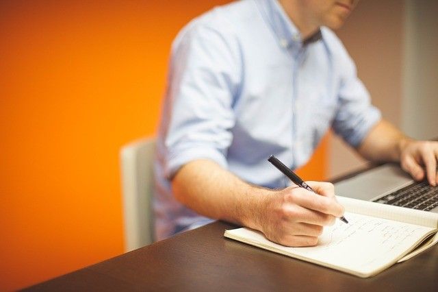 Man sitting at lap top applying for jobs