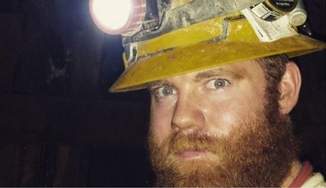 Miner wearing a headlight