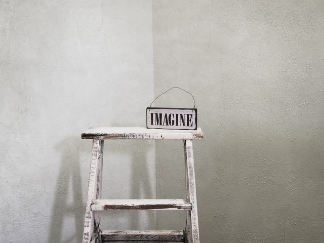 Ladder with the word imagine on the top step
