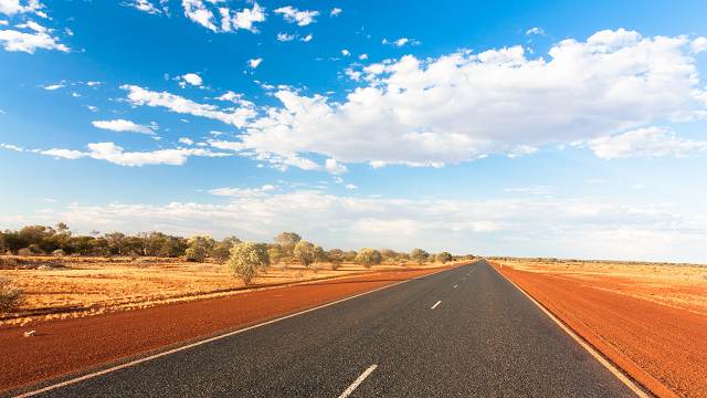 long straight road with blue sky