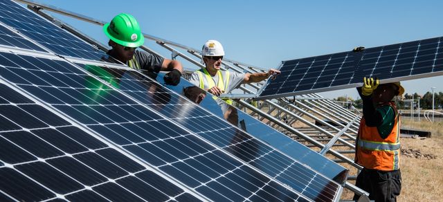 Men installing solar Panels