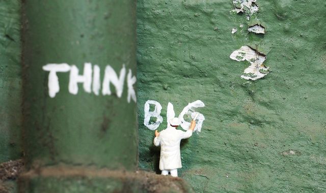 Picture of a man spray painting