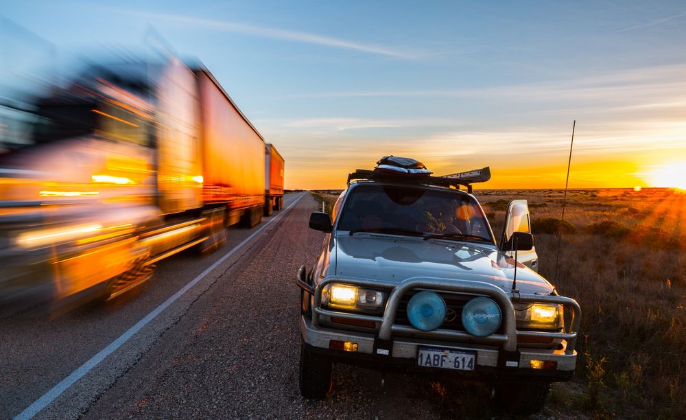 Vehicles on the Nullabor Plain, symbolizing the coronavirus hard border closure between Western Aust