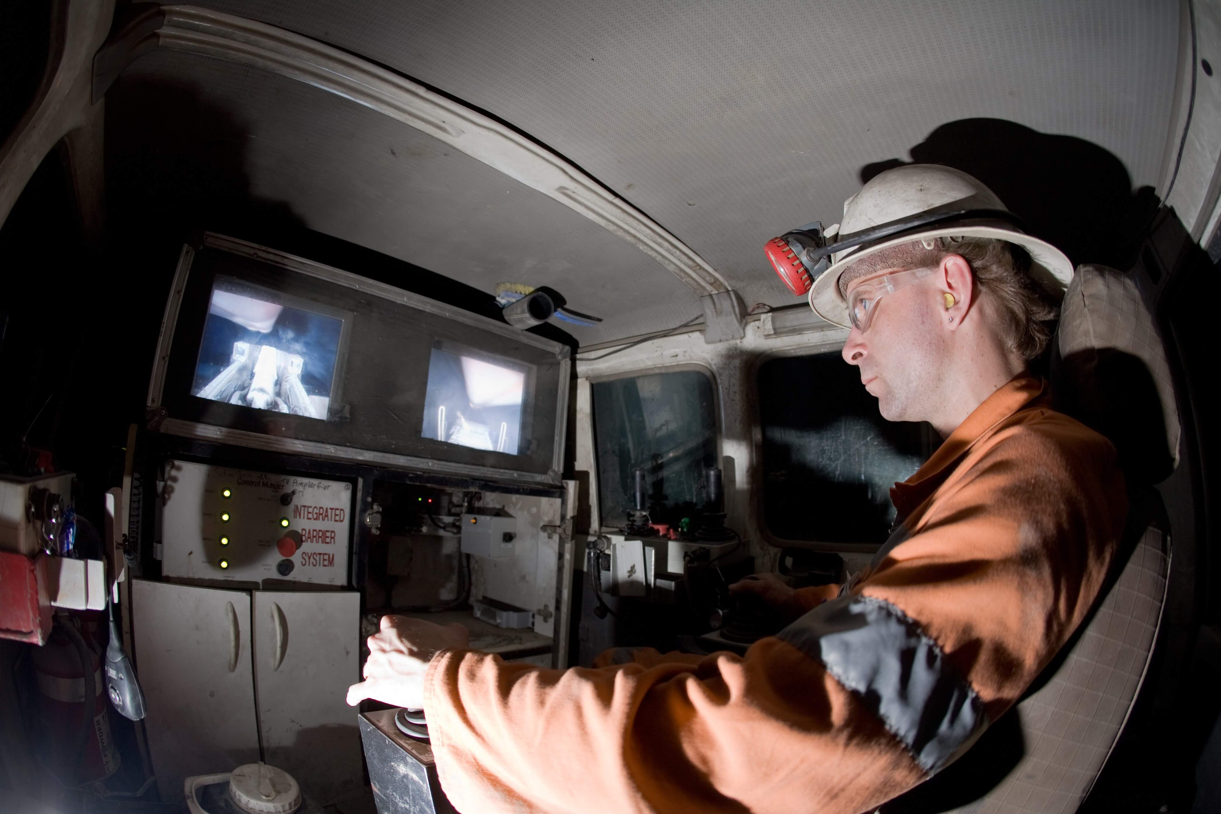 Someone operating underground mining equipment