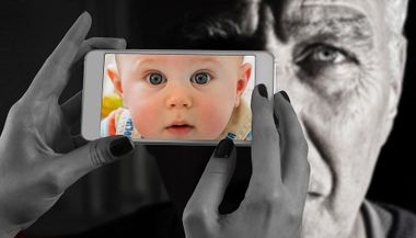 Picture of a person holding a phone