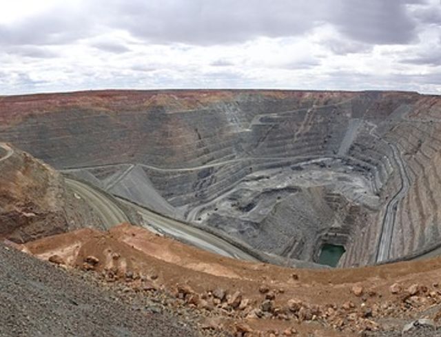 Gold mine in land. Cloudy sky, many layers