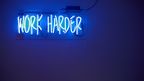 'Work Harder' neon sign