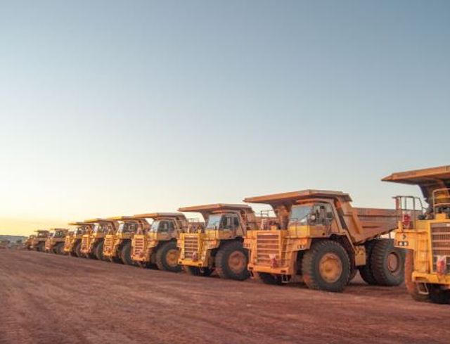 Dump trucks in a row