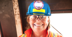 Female mine worker smiling