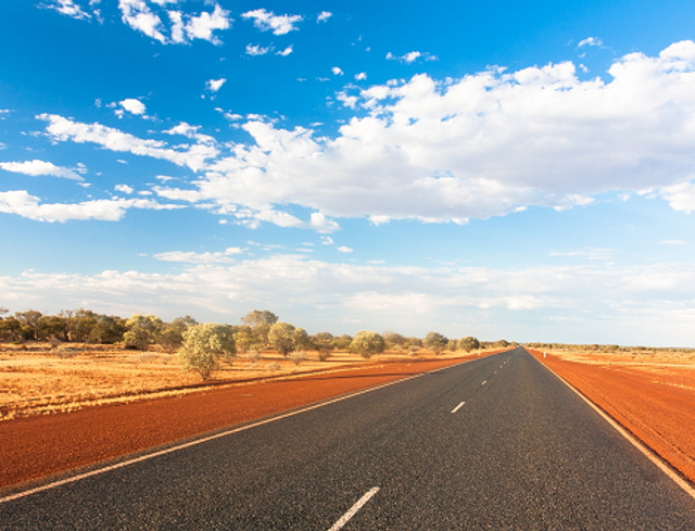 long straight road with blue sky