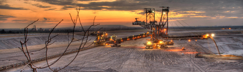 Mining site at dusk with lights on